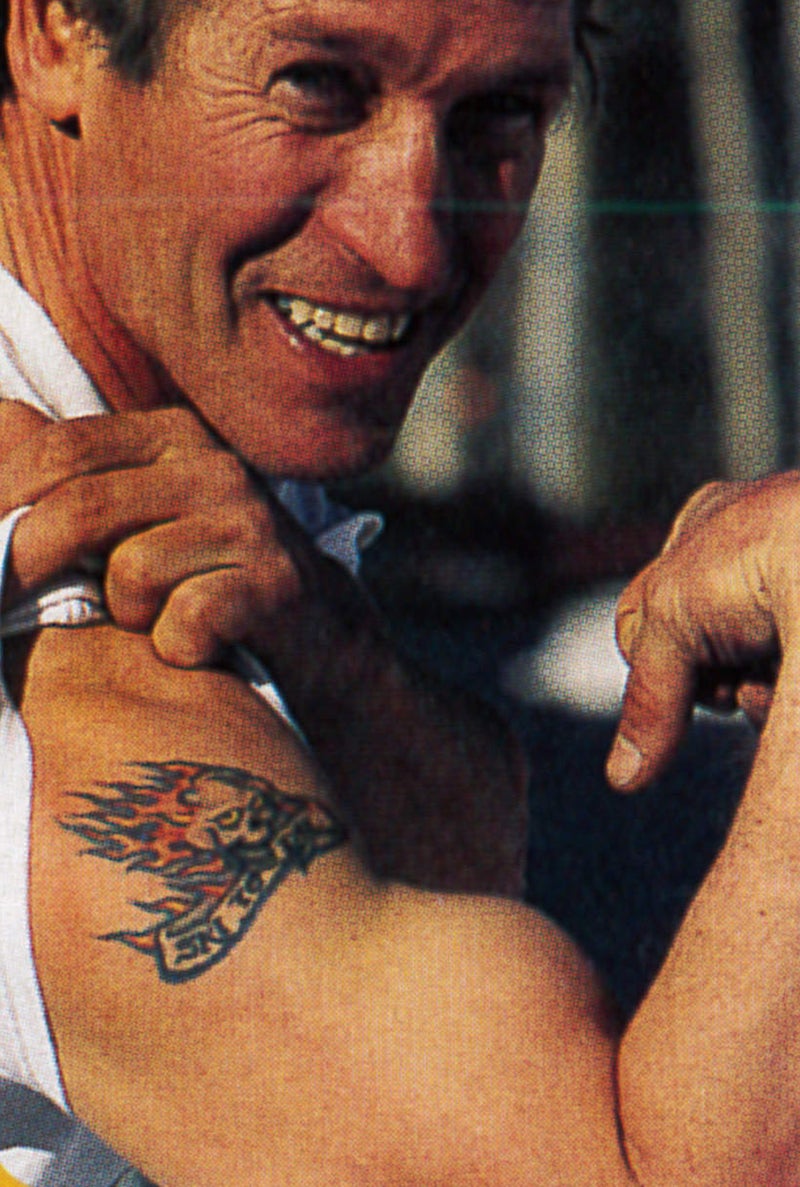 Johnson, prior to the accident, flashing his tattoo.