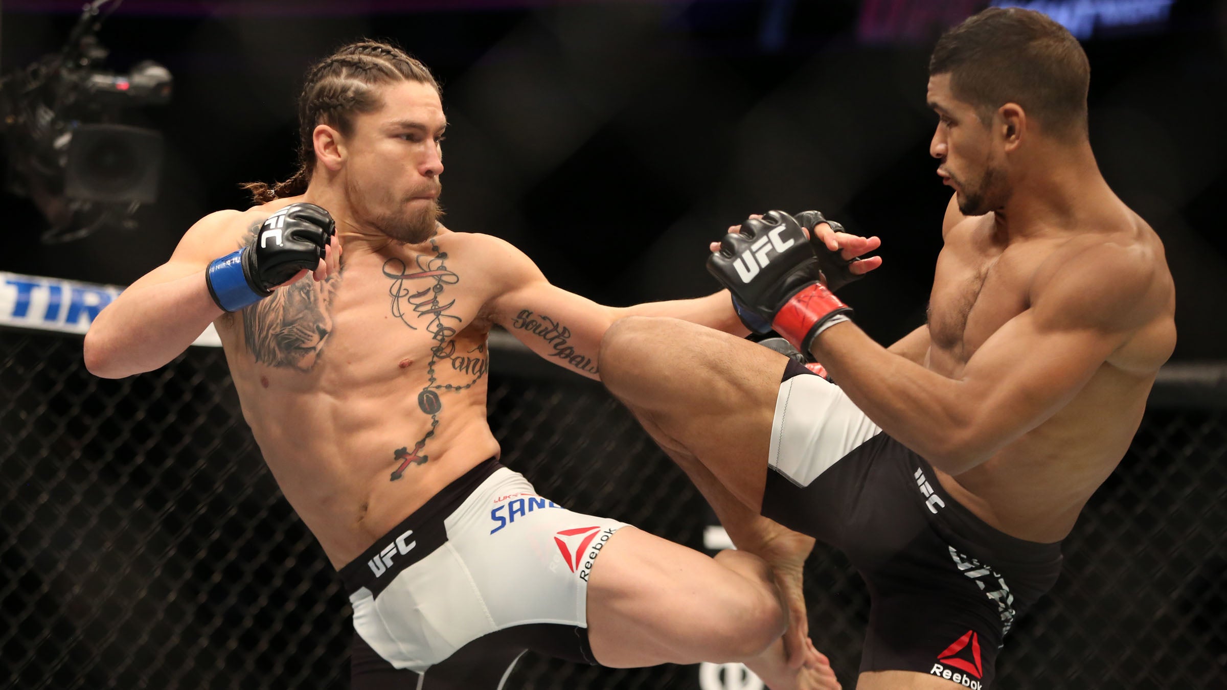 Sanders, left, took the biggest fight of his life on short notice and still won. Credit his year-round fitness.