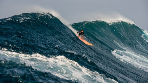 Eli Olson, a promising 23-year-old Hawaiian, has become a regular at Jaws in recent years. Here, he catches a modest wave that, during any other swell, would have most likely been the biggest of the day, says Moss. The streak of light blue water in the foreground is the trail of a passing photographer jockeying for position鈥攅vidence of the day鈥檚 chaos.