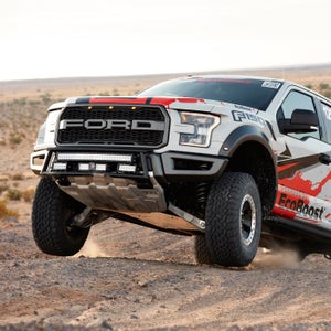 The 2017 Ford F-150 Raptor race truck gets a little air during testing. Due to liability, Ford isn't supposed to show the truck jumping at all. Take it from us: it can.