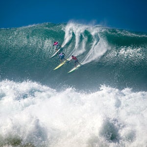 Surfers at the 25th Eddie Aikau Big Wave Invitational in December 2009. It was the biggest swell on the North Shore in 10 years with up to 50-foot waves.