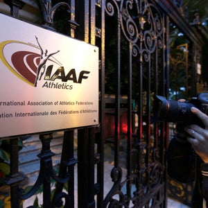 FILE - In this Nov.13, 2015 file photo, a photographer pictures the logo at the IAAF (International Association of Athletics Federations) headquarters in Monaco. French prosecutors have opened an investigation into the decision to award the 2021 track world championships to the American city of Eugene without an open bidding process. (AP Photo/Lionel Cironneau, File)