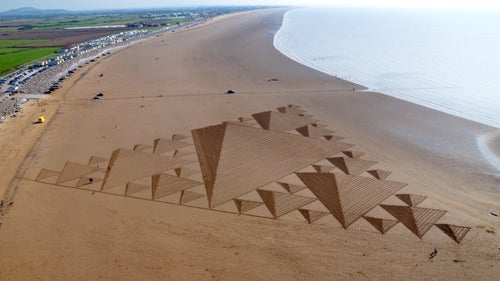Although he prefers the texture of snow, Beck has done around 50 sand drawings. Sand art, he says, is a 鈥渞ace against the incoming tide.鈥 Here, a large-scale, 3D Sierpinksi triangle adorns Brean Beach in England.