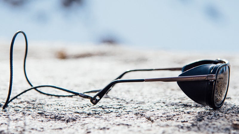 A leather leash mounts to the earpieces with a simple, seamless connector. Clever.