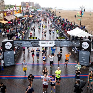 Runners celebrate their finish in the Airbnb Brooklyn Half, Coney Island,  on May 16, 2015. (Courtesy NYRR)