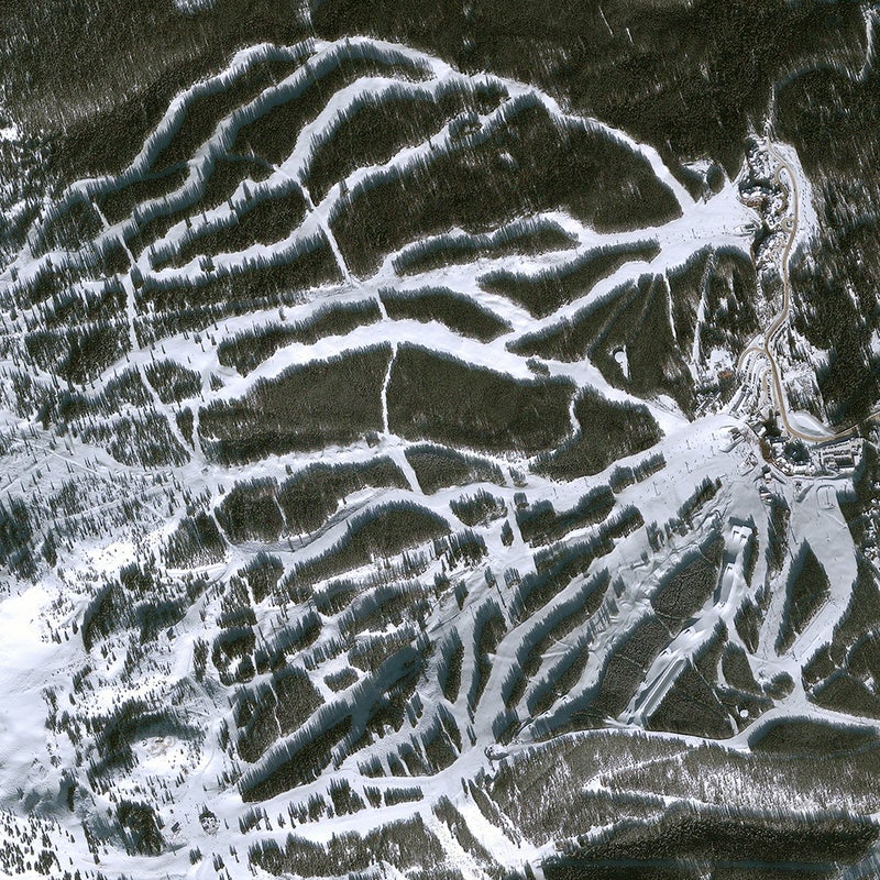 This shot, taken in January 2013, shows Breckenridge Ski Resort’s wild terrain, which tops out inbounds on the resort’s Peak 9, at 12,998 feet. Here we see Peak 7’s lower runs funneling into the Independence Superchair, with intermediate slopes spilling down to luxury condominiums.