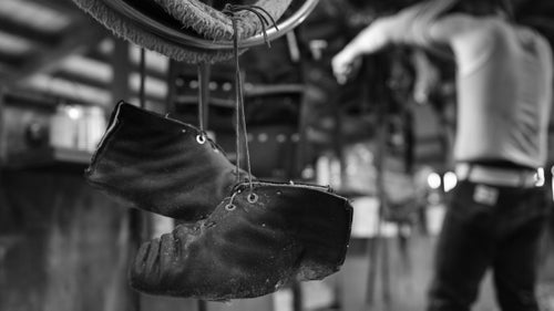 Lanolin, the natural wax secreted by wool bearing animals, greases the floors of shearing sheds, so shearers have to wear special moccasins with a non-slip coating for solid footing.