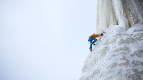 Anker kicks into the base of a large pillar of ice called Dairy Land.