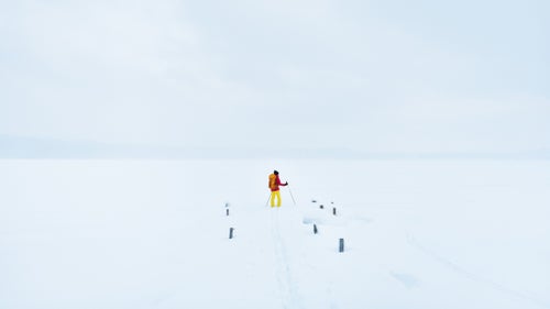 Pohl stands on the dock near the East Channel Lighthouse looking out on a snow covered and frozen Lake Superior. The local guides from the Upper Peninsula, who referred to themselves as UPers (pronounced 鈥測oopers鈥), assured the team that it鈥檚 safe to travel on the ice, so long as it鈥檚 at least 6 iches thick.