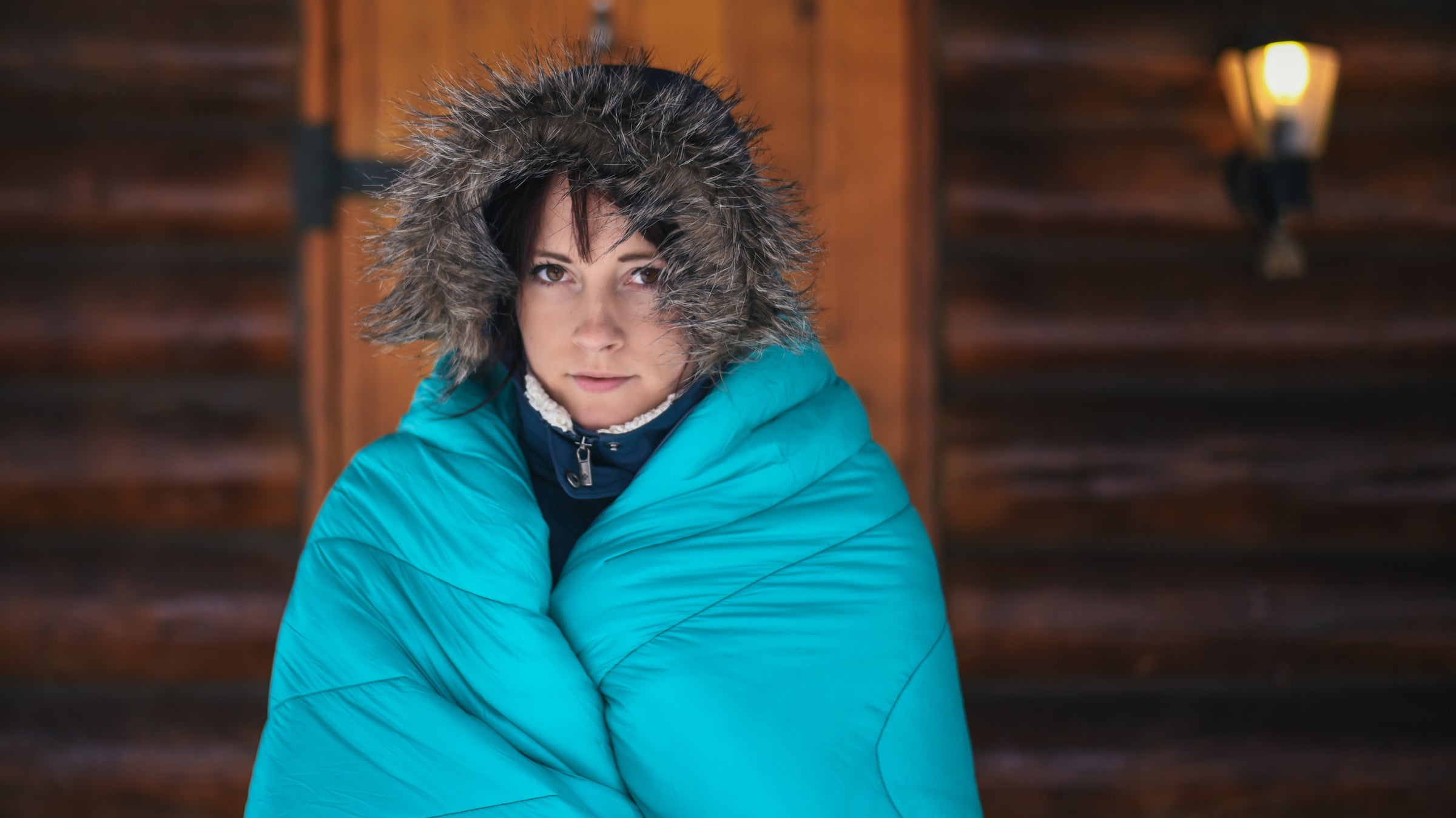 The Down Puffy is available in this solid cyan, or black, with cyan accents. 