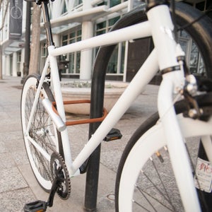 Click a button on the lock and it senses an app on your phone via Bluetooth and immediately comes apart.