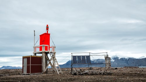 A brightly colored observatory station situated about a mile from Ny-Ålesund.