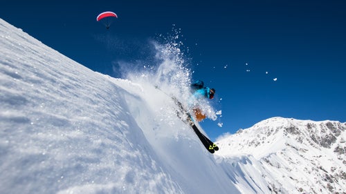 Brunso getting photo-bombed by one of the many paragliders flying around Adelboden.