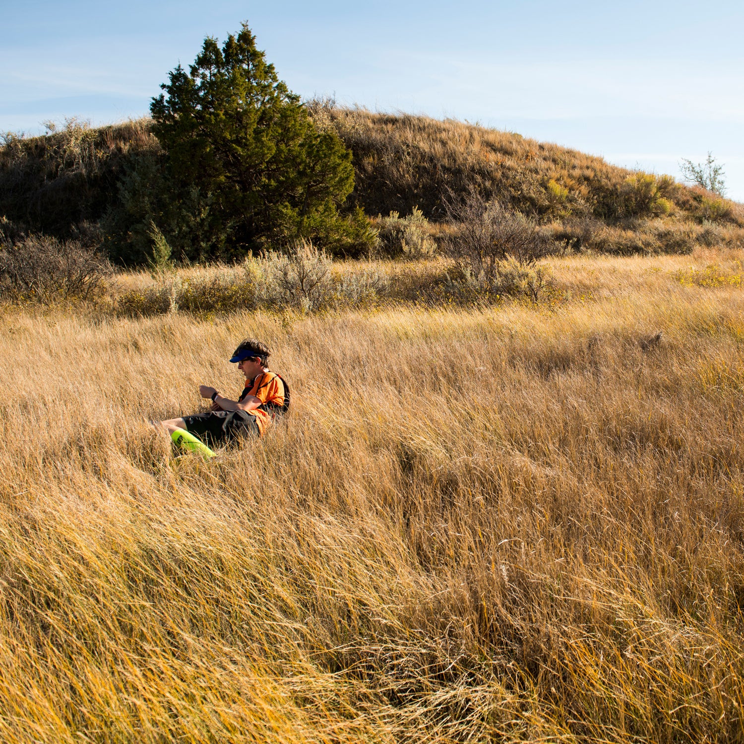 Tim Neville rests in the Grasslands of North Dakota during his 4-day adventure through Theodore Roosevelt National Park and the Maah Daah Hey Trail.