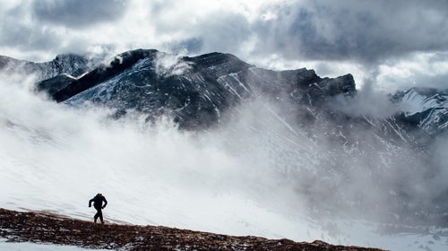 Mike Horn runs up a mountain in Alberta, Canada, while training for his north-south global circumnavigation.