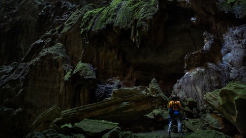 Jesse Barden inspects a piece of broken flowstone at the base of Golondrinas. Looking at formations like this makes you wonder what the interior of the cave looked like prior to the ceiling collapse, which revealed the cave to the surface.