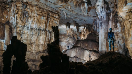 Cavers give scale to this gigantic passage in Cueva De Linda (“beautiful cave”). This photograph was captured using five off-camera flashes which were fired using radio transmitters. The echo in this cave was so great that you could not communicate with another person unless they were within a 25-foot range.