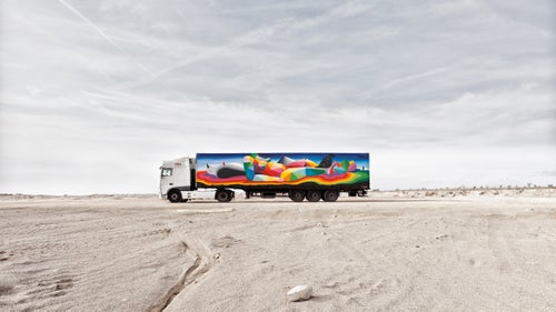 Going into the project, San Miguel was inspired by the truck鈥檚 very horizontal format to develop a scene involving a body lying in a landscape. Only when he started painting did he decide to add a series of faces on the other side, to make it seem as if the art was staring at the passing viewers. 聽
