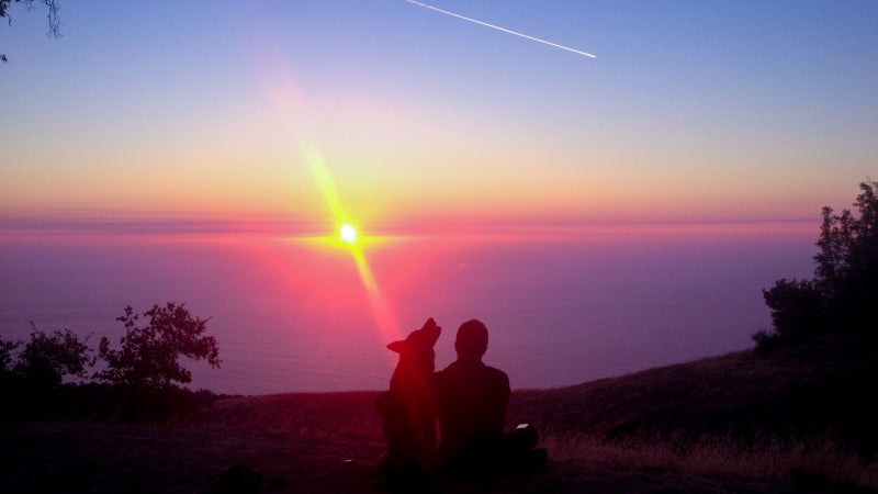 Wes and Wiley watch the sunset from Big Sur's Prewitt Ridge.