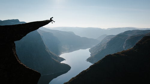 Daniel Bruce Lee hangs out on Norway's Trolltunga, perched 2,300 feet above the lake below.