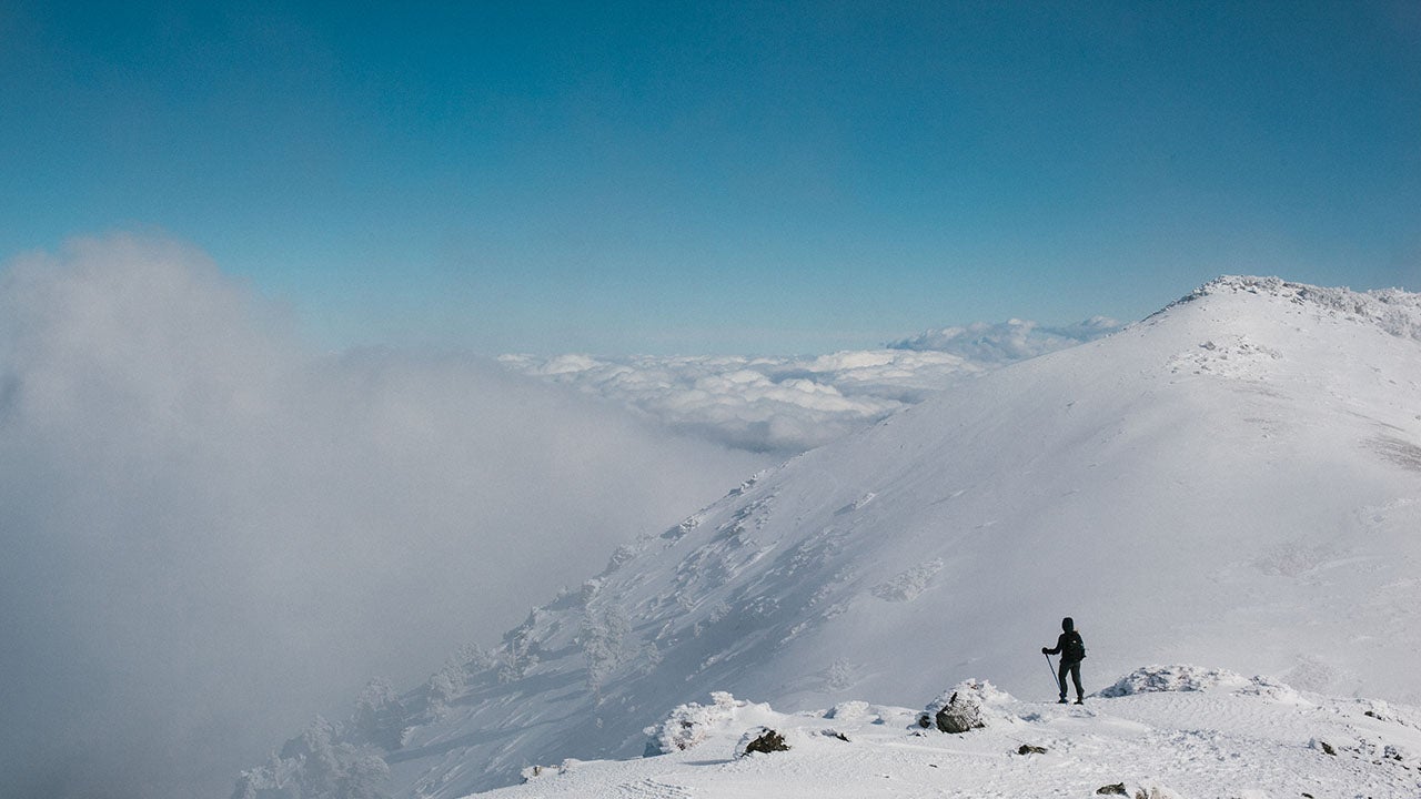 A hiker approaches southern California's Mt. Baldy. 