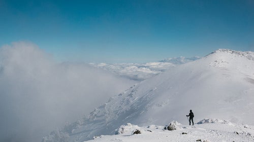 A hiker approaches southern California's Mt. Baldy.