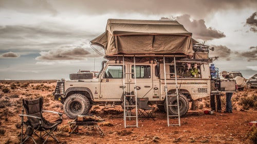 Our family of four needed to find a way to sleep high and dry. The XL roof tent by South African Howling Moon provided a nest where we could sleep well, huddled, warm, and comfortable. Here we wait for the 2015 Dakar rally in Bolivia.