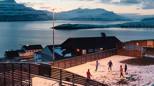 There鈥檚 a set of islands in the middle of the chilly North Atlantic, some of which are so sparsely populated that the residents wouldn鈥檛 even fill a classroom. The Faroe Islands, an archipelago comprising 18 islands halfway between Scotland and Iceland, make up in an eclectic culture and stunning views what it lacks in population size.
The villages on the smallest and toughest islands have seen a sharp decline in population over time. In a lot of villages, half of the houses stand empty. The Faroese are constantly moving away from the smallest villages, settling in the bigger, main villages. Young Faroese people move abroad鈥攎ainly to Denmark, to travel or to pursue a higher education, and mostly they don鈥檛 return to their hometown afterwards.
I spent a month on the Faroe Islands last February. My goal was to visit and document life in these incredibly quiet, remote villages. The resulting series is called 贵酶谤辞测补谤, which is the name of the country in Faroese鈥攁 language that is spoken in the world mostly by people living on the islands, or who have moved elsewhere from the islands.
Photo: Children playing soccer in the village of Nes on Eysturoy Island. Population: 29.