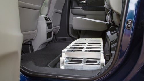 With the rear seats folded down, the Ridgeline easily accommodates two mountain bikes with the front wheels removed. The back row is a squeeze (a 6’2” tester couldn’t comfortably sit behind the driver), but this space is still roomier than that in the Tacoma or Colorado.