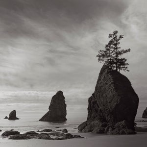 Charleston-based photographer Drew Doggett’s recent project, Shadow’s Alight; Portraits of the American West, is the result of 14,000 miles traveled in a 23-foot airstream, visiting 21 national parks. Doggett has spent much his career photographing foreign places and people whose communities are in imminent danger due to development and a lack of conservation efforts. But he wanted to turn his lens toward his own country. In celebration of 100 years of our National Park Service, Doggett set out to capture some of America’s most classic scenes to see how they’ve changed, how they’ve stayed the same, and ultimately why they’re worth protecting. Here, Doggett shares a few favorites from his recent project. 
Photo: This image was taken on the furthest part of Shi Shi beach, Oregon, one of the most northwestern points in the United States. A several hour’ hike from the nearest road, this beach is one of the most secluded in the U.S., lending a real feeling of nature at its most untouched.