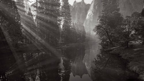 Another early morning on the Merced River was enhanced by smoke in the air from a nearby controlled burn, which made every ray of light visible as they shot through the trees.