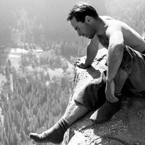 Yosemite climbing pioneer Yvonne Chouinard checking out the view from Big Sur ledge the first ascent of the North America Wall on El Capitan.  End of pitch 11, Fall 1964.