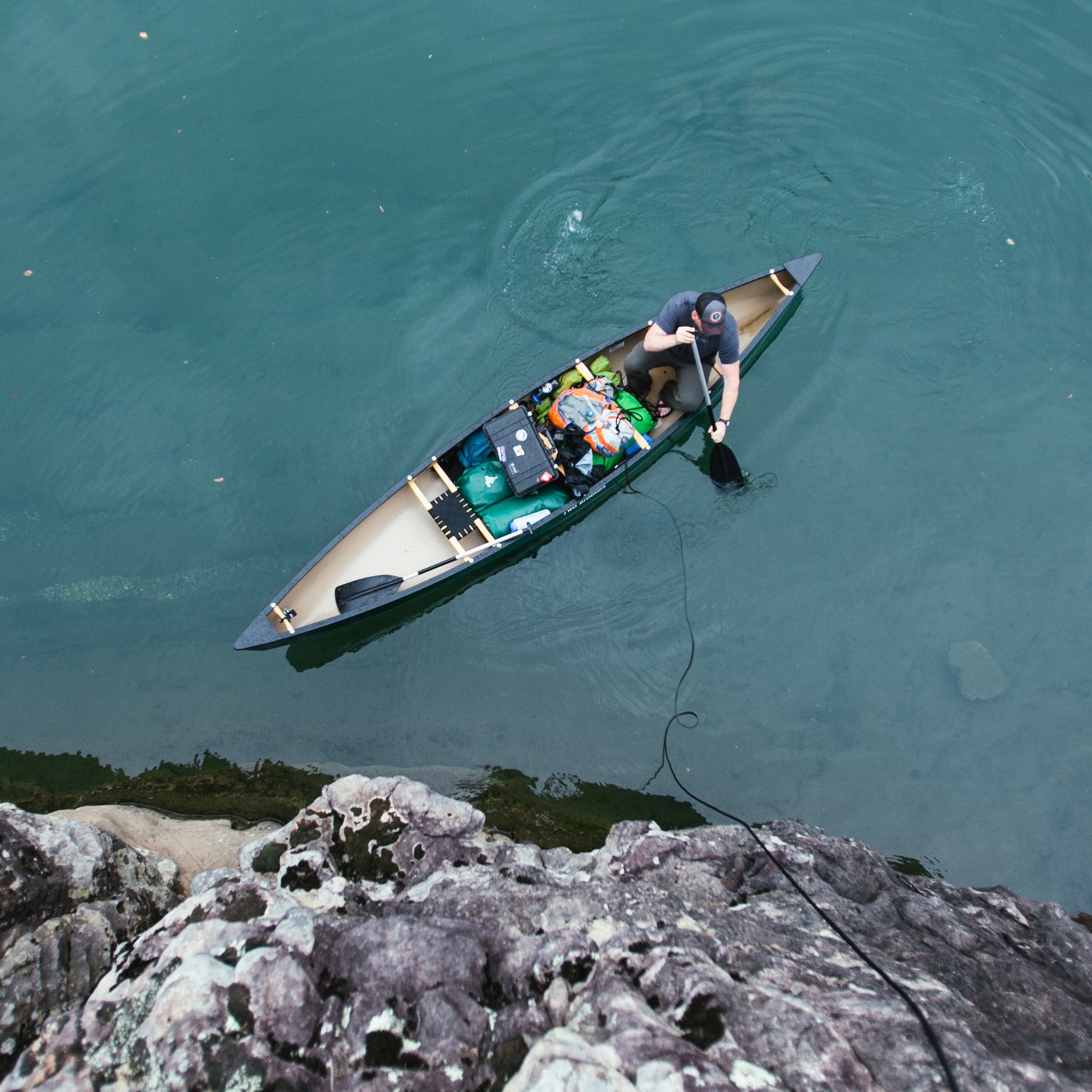 Exploring the Ozarks by way of the Buffalo River Released. Male exploring the Ozarks in his canoe on the Buffalo River in Arkansas.