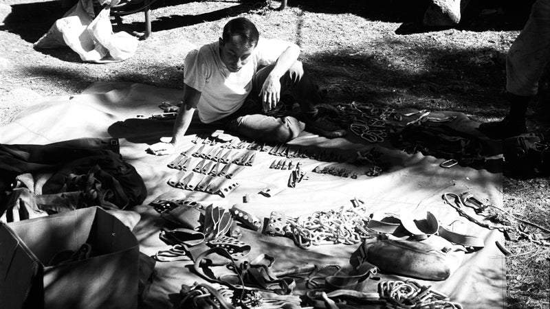Yvon Chouinard selecting pitons at Camp Four in 1964.