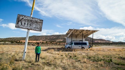 A rare pause in the action: Brody and their RV at a classic American roadside attraction.