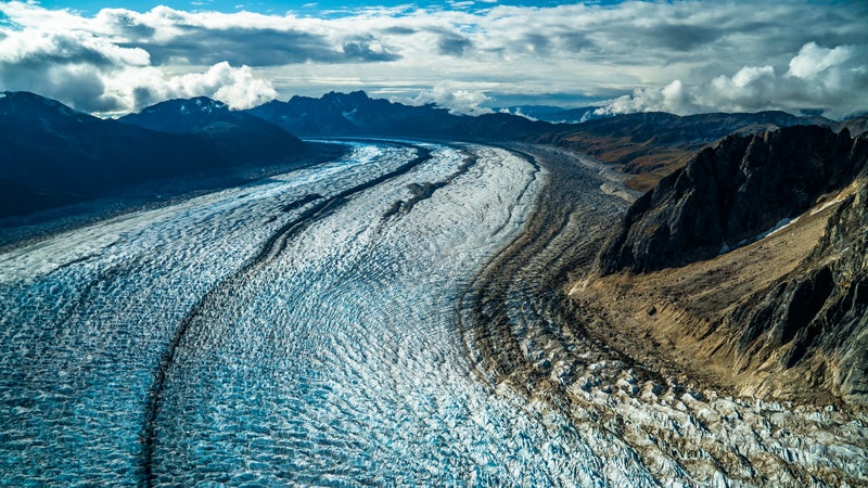 "Surrounded by thousand-foot peaks on both sides, you feel like you're at the gates of some unearthly place," says photographer Chris Burkard.
Though he'd planned to spend only two nights at a hut in southeast Denali National Park last October, bad weather forced him to extend his stay to four. "These were gnarly storms," says Burkard, of San Luis Obispo, California, who was in Denali to explore the Ruth Glacier on skis and snowshoes. Then the skies cleared, offering a view by bush plane of black granite moraines forming streaks along the glacier's tongue.
THE TOOLS: Sony Alpha a7R II, 24-70mm f/4 lens, ISO 200, f/5, 1/1,250 second