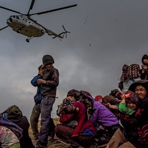 An aid helicopter arriving at the village of Gumada, in Nepal's Gorkha District, last May