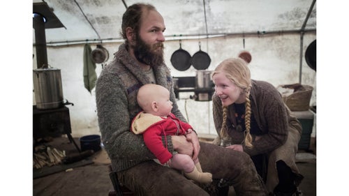 Alex, Epona, and their son relax in a wall tent after a day of scavenging buffalo parts. Buffalo Bridge sets up a tent camp on a landowner鈥檚 property near Gardiner, Montana for the duration of the annual hunt.