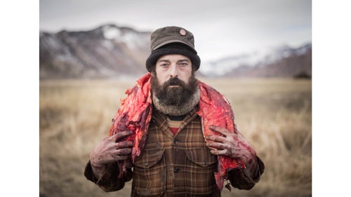When Yellowstone National Park was created in 1872, hunting was strictly banned within it鈥攅ven for the the Native Americans who had lived and hunted there for generations. It wasn鈥檛 until 2006 that the Nez Perce, Confederated Salish, and Kootenai tribes successfully petitioned the government to be able to hunt bison when they left the park and within the annually regulated cull鈥攁 federal initiative started to manage and combat bison from spreading diseases to other livestock outside the park. Every winter, groups of Native American hunters wait near Gardiner, Montana, near the park鈥檚 northwest corner, for the herd to leave the park in search of food, so the hunt can begin. Accompanying them are a group of scavengers who collectively call themselves Buffalo Bridge that live off the remains of bison from the hunt. Working with the Native American hunters, Buffalo Bridge members offer their skills and help in field dressing the animal after the kill. They are often given parts of the animal for their work. Photographer Matt Hamon spent a few days with them this winter. Photo: Buffalo Bridge see their efforts as a way of honoring the bison through education and by utilizing as much of the animal as possible. Here, Josh assists a Native American hunter as he carries a buffalo back strap from the hunting ground.