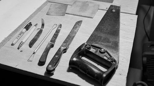 Saws, knives, files, wire loops, and sandpaper are the tools of the trade. 聽A shaper often starts by sawing a chunk from a large block of foam. From there he uses progressively more precise tools as the hold takes shape before him.聽From the finished shape, a manufacturer makes molds. Those molds are then filled with urethane plastic to mass produce the holds originally shaped in foam. 聽