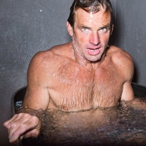 Big Wave Surfer Laird Hamilton takes a bath in an ice tub.