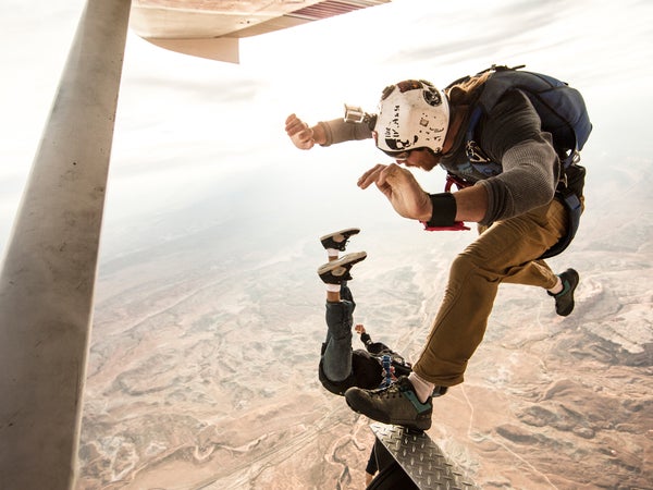 Adam Krum (top) and Nicholas Reyes of Skydive Moab taking flight above canyon country.