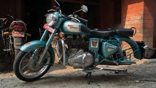 Blue Eyed Betty, Royal Enfield #1, breaks down 45 minutes into day one of our ten-day trip into the Mustang. One of countless mechanical problems we would encounter on this trip—from fouled plugs, broken fuel injectors, flat tires, broken gear shifters, lost mufflers, broken rock guards, bent brake levers, and leaking gaskets, just to name a few.