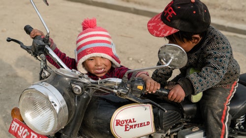 Who doesn’t want to race through the desert on a motorcycle? When we rolled into town, these kids were in hog heaven! We would later realize that these lovely children utilizing the bikes as jungle-gyms broke the shifting linkage and left us with only first gear on the black Enfield.