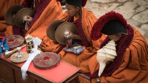 Monks in the walled city of Lo Manthang in Mustang, once a forbidden kingdom of Nepal, take part in the Tiji festival.