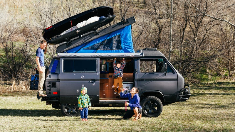 Brendan and Chloe Couvreux with their two boys and their 1990 Volkswagen Westfalia.