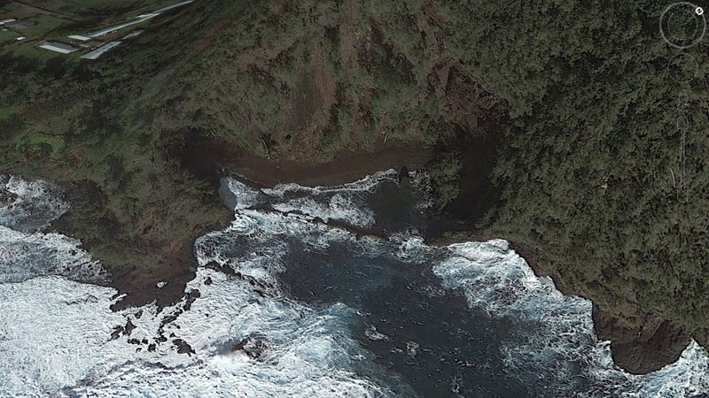 Hana's Red Sand Beach. You can paddle in the calm water behind the barrier rocks, spear fish underneath the rocks in the foreground, and cliff dive off the big rock on the right.