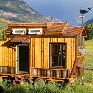 By land or by sea, we like this tiny nautical mountain house.