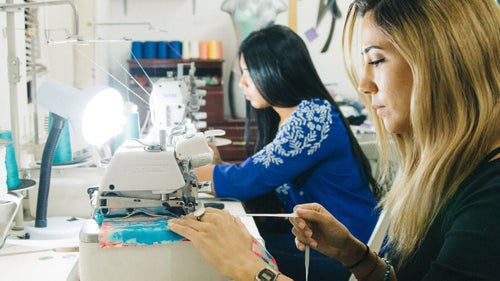 Co-founders of the swimsuit line Renata and Gabi at work in the shop.