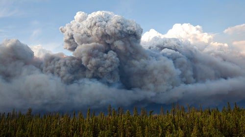 The wildfires raged across Northern Alberta and forced the evacuation of about 88,000 people in May, damaging Fort McMurray neighborhoods, oil-production facilities and businesses.